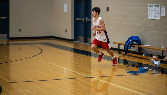 High school player sprinting during basketball practice