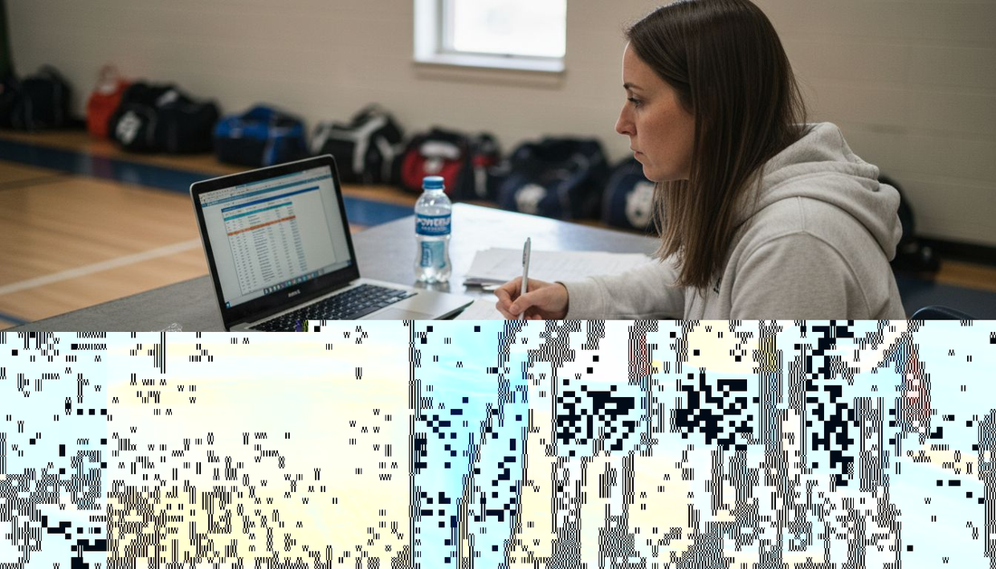 Coach points clipboard with bench players listening